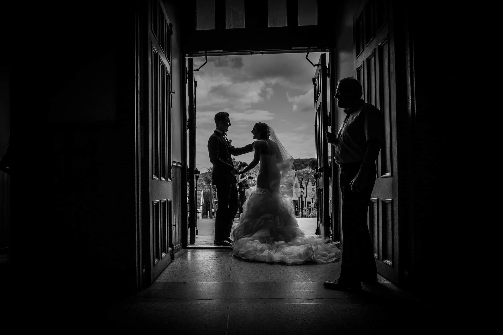 bride groom church exit dramatic black and white