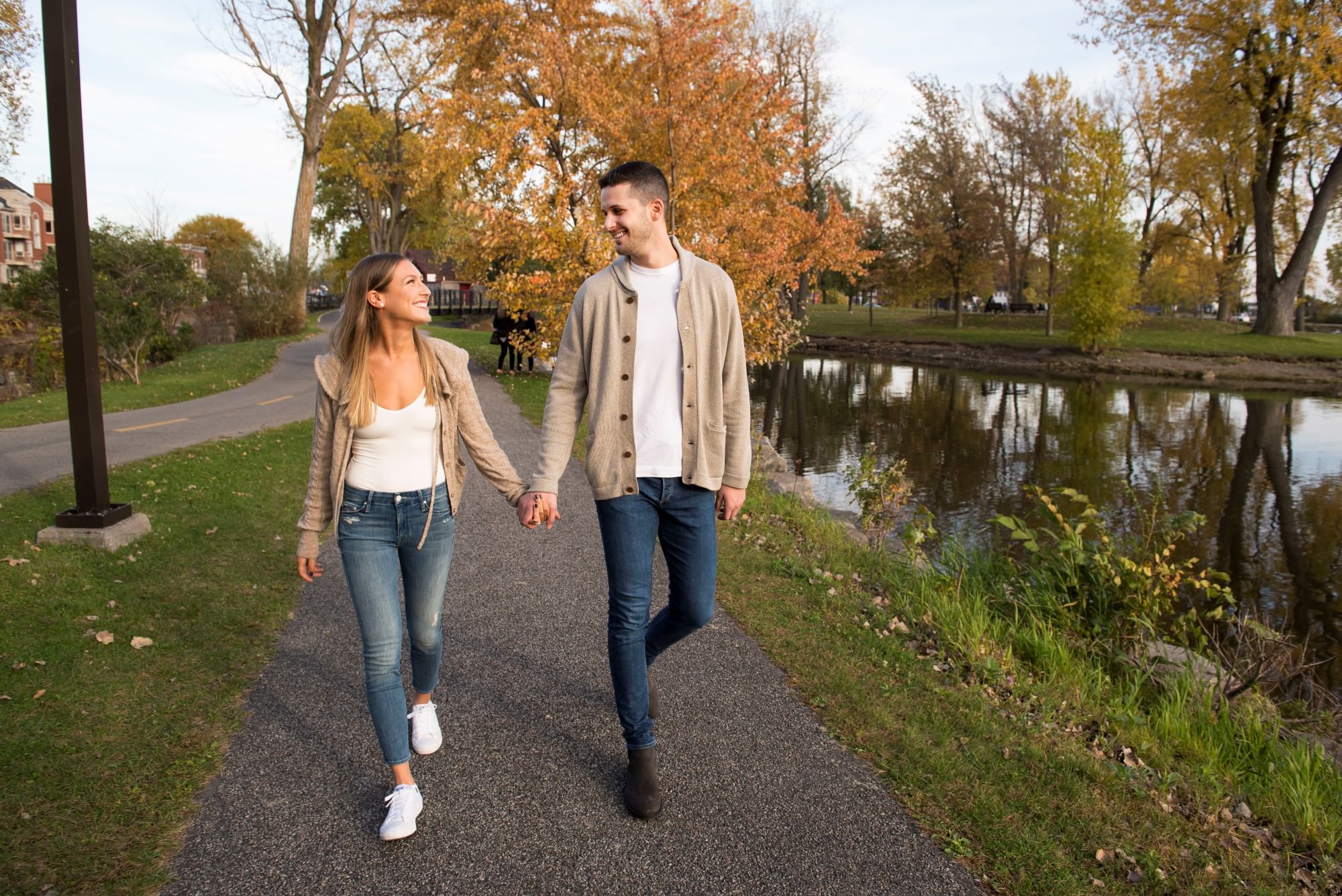 suzy rossdeutscher greg kirstein jeans casual engagement esession prewedding photoshoot shoot lachine canal jewish young trendy romantic couple looking each other matching outfits walking